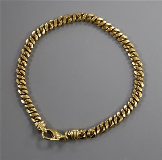 An 18ct gold curb-link bracelet with trigger clasp, 16 grams.